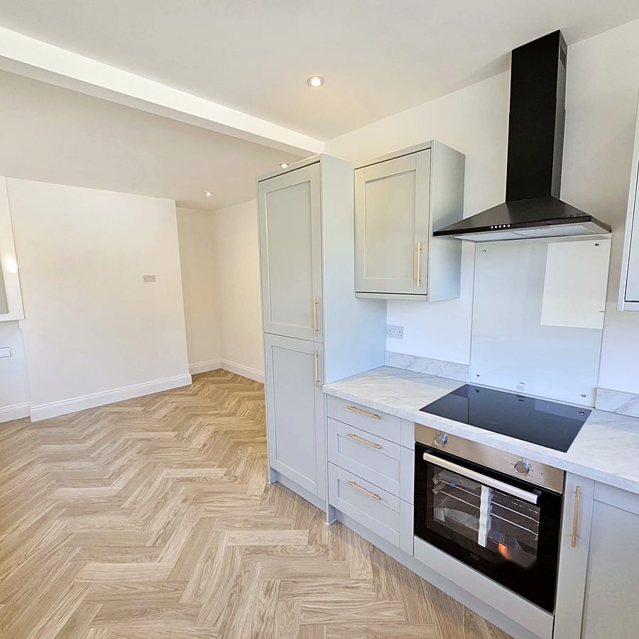 Shaker kitchen opening onto a dining area